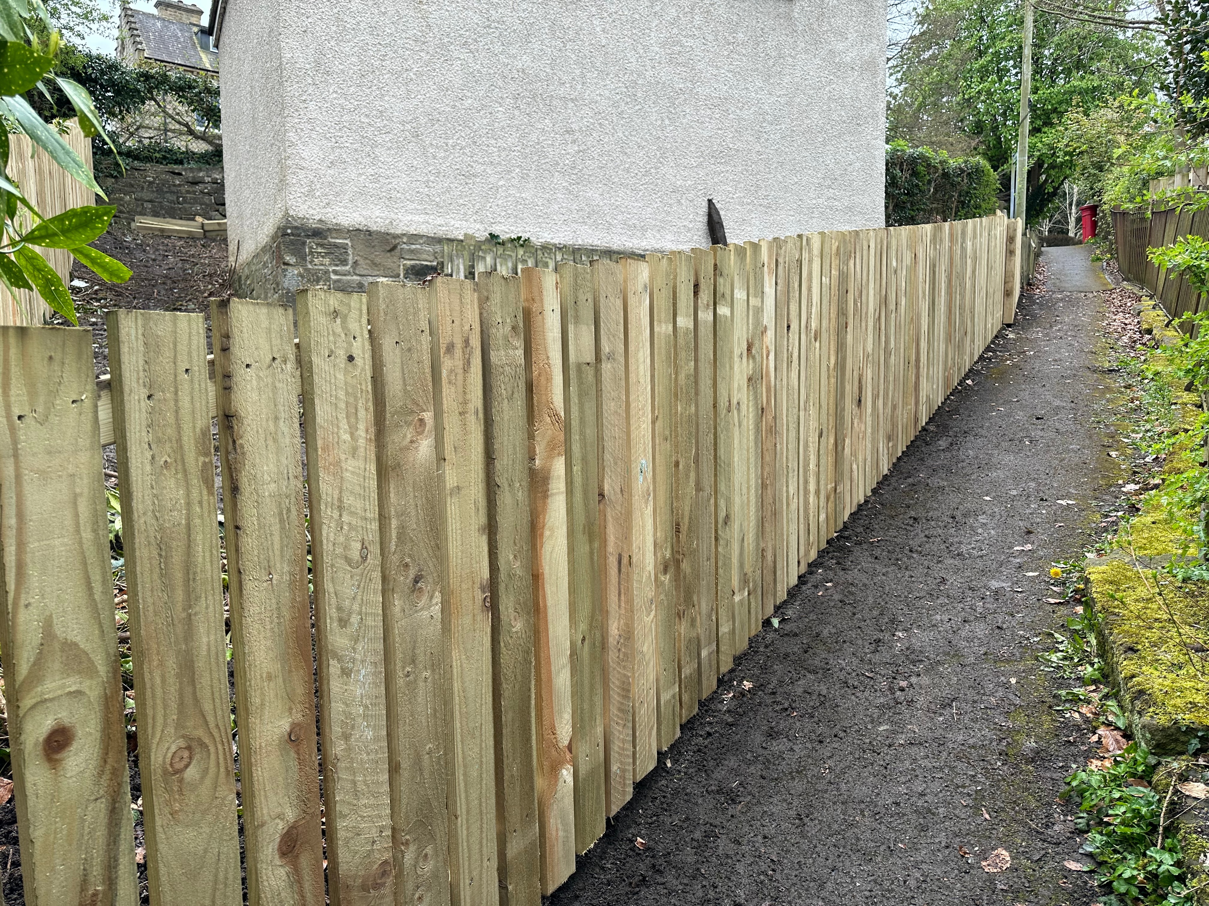 After — Close-board fence & paving transformation